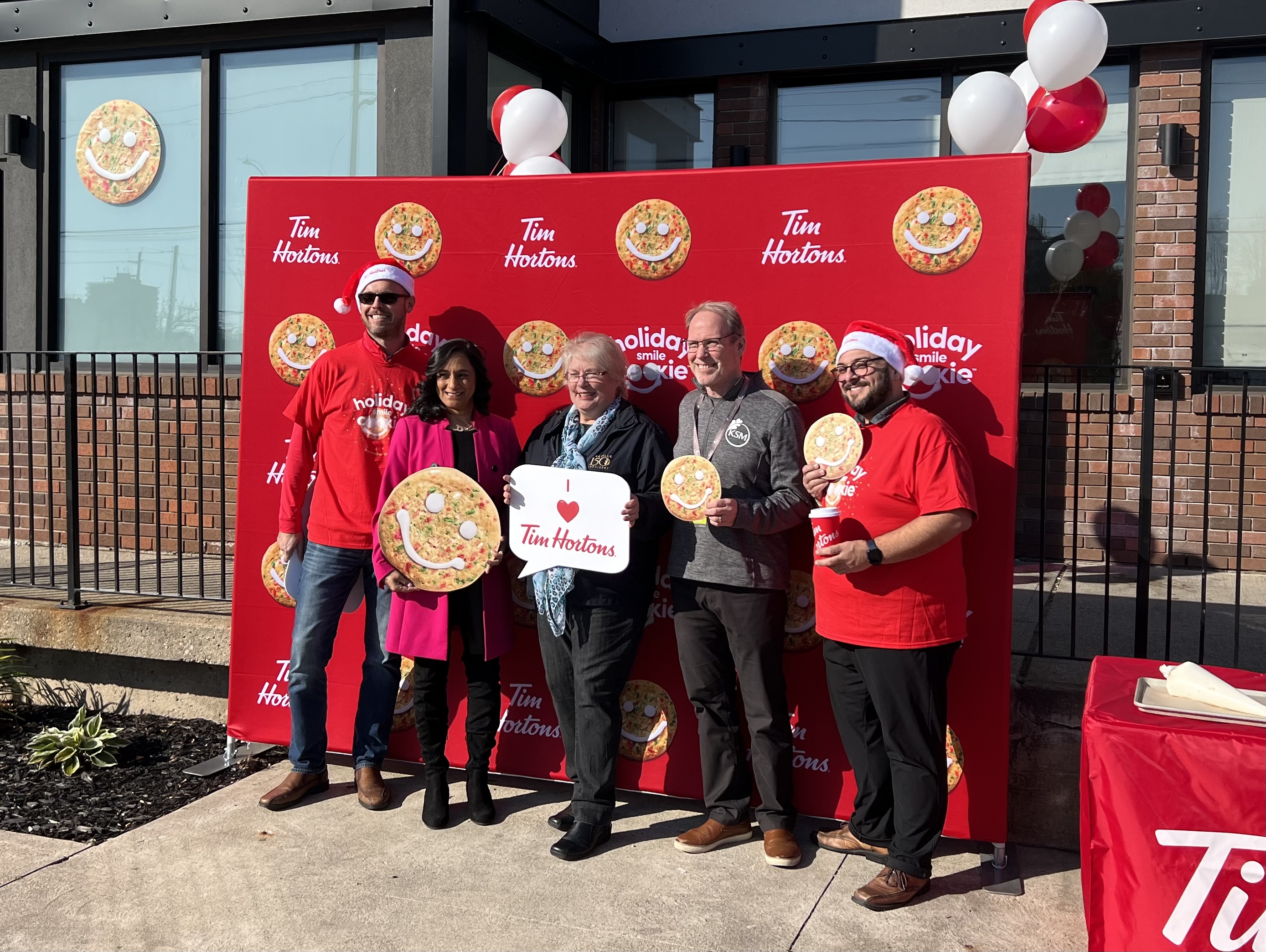 Flanked by local Tim Horton franchisees, MP Anita Anand, Regional Councillor Cathy Duddeck, and KSM Executive Director Gary O
